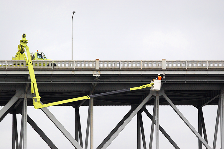 A photo of workers conducting a bridge inspection
