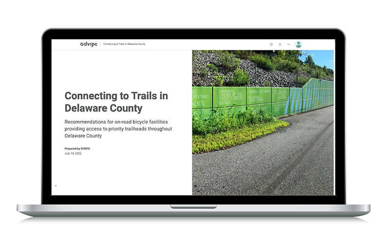A laptop displaying the cover for the Connecting to Trails in Delaware County story map