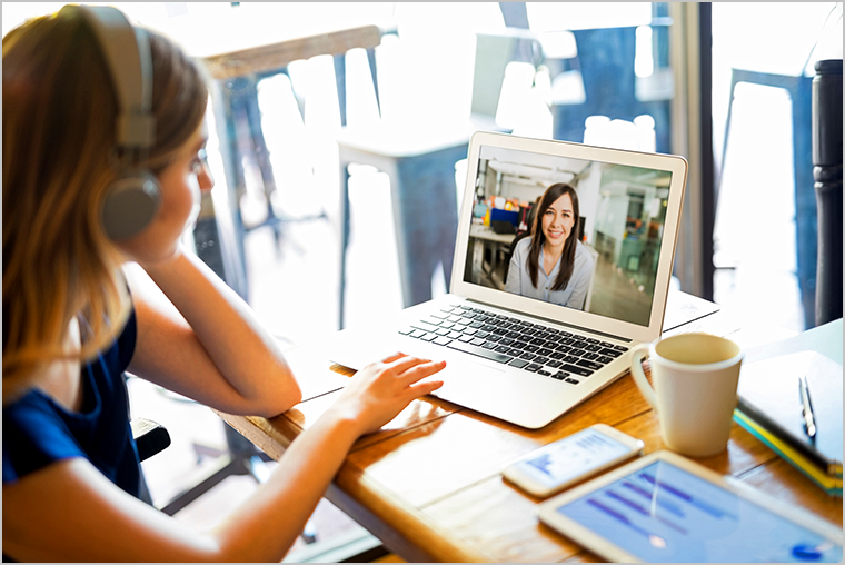 Woman attending a virtual meeting on a laptop