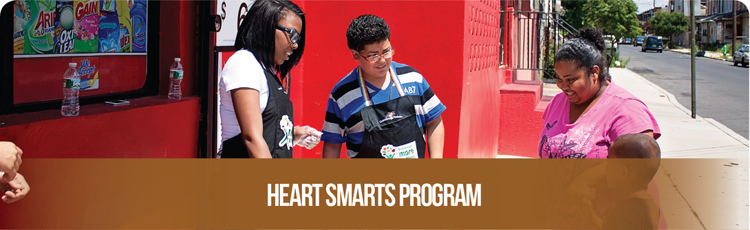 Heart Smarts Program Banner.  Image of students providing nutrition education at a Camden corner store through the Heart Smarts Program.